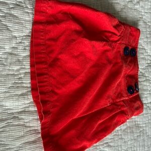 Orange corduroy skirt.